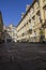 Long shadows cast on alleyway in courtyard