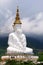 Long shot of five sitting white Buddhas and the foggy hills behind the Buddha at Pha Sorn Kaew, in Khao Kor, Phetchabun, Thailand.