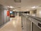 Long shot of an illuminated office corridor with lined with cabinets