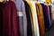 Long sleeved t-shirt many colours hanging on the rack,comfortable clothes and cheap,variety of popular fashion clothes in asian