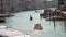 Long Slow Zoom in to a Gondola on the Grand Canal in Venice, Italy on a Sunny Day