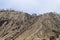 Long staircase on black sand on the wall of bromo volcano