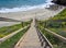 Long Staircase Leading onto California Beach with Ocean