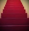 Long staircase with red big steps with vintage effect