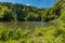 Long steel hanging footbridge over Modre lake