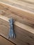 Long steel nails on wood background