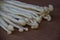 Long stemmed mushrooms on wooden background