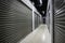 Long storage facility corriodor. Garage doors with light