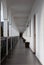 Long, straight corridor with white walls