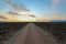 Long straight dirt road at sunset in Camdeboo National Park