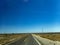 A long straight open road in the deserts of Baja California