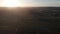 Long Straight Road In Vast Green Landscape at Sunset, Aerial