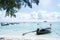 Long tail boat on the deep blue sea shore