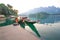 Long-tail boat and lakeside raft houses on Cheow Lan Lake, Khao