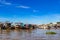 Long-tail boats, house boats and sampans moored side by side in Mekong Delta, Vietnam