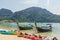 Long-tail boats and kayaks parked at the tropical bay in Thailand. Ocean. Asia.
