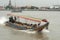 Long tail motor boat with passengers cruise on the Chao Phraya river