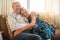 Long term love. Isnt it beautiful. Portrait of a happy senior couple relaxing on the sofa together at home.