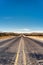 Long Texas Road disappearing into horizon