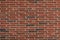 Long thin bricks in red and dark brown with a fine combed surface texture, creative copy space