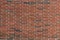Long thin red brick with finely textured surface, urban background pattern