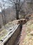 Long trench dug into the rock by army soldiers during the war wi