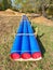 Long tube on ground. Colorful thick wall of plastic pipe