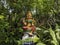 Long view of Goddess Sri Gayatri devi idol isolated in Natural arch rock garden