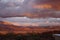 A long view of a sunset on the Sandia mountains