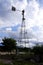 Long view of weather vane metal tower isolated in outdoor