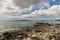 Long white clouds above Rangitoto Island