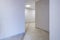 Long white empty corridor in interior of entrance hall of modern apartments, office or clinic