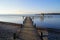 a long wooden pier in Herrsching on Lake Ammersee in Bavaria on a clear December day (Germany)