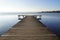 a long wooden pier in Herrsching on Lake Ammersee in Bavaria on a clear December day (Germany)