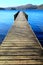 Long wooden symetrical beautiful wooden jetty, jutting out from