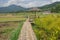 Long woven bamboo bridges to mushroom shed and pavilions