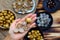 Longan fruits in people hand with black seed, yellow peel, cut in half background