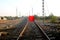 The longest railroad tracks with stop red flag close signal - Image