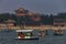 Longevity Hill and Summer Palace with boats on Kunming Lake and a heavy smog in the sky in Beijing China