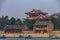 Longevity Hill and Summer Palace with boats on Kunming Lake and a heavy smog in the sky in Beijing China