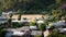 Longneck karen village in the mountain with football pitch or soccer field. Mae Hong Son, Thailand. Aerial Shot