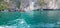 Longtail boats at Maya Beach with turquoise water and limestone rocks