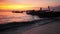 Longtail boats on seashore at sunset