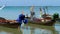 Longtail fisher boats on beach