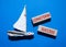 Longterm success symbol. Wooden blocks with words Longterm success. Beautiful blue background with boat. Business and Longterm