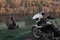 Lonley concept, man is sitting alone and look at the distance. Adventure motorcycle, Motorcyclist, A motorbike driver looks,