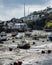 Looe harbor with low tide boats moored .  Cloudy Spring day. Looe Harbor, Cornwall, UK