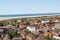 A look from above the lighthouse over the northern sea island borkum over the buildings the beach and the sea