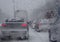 Look from the car of heavy snow causes traffic trouble on the frozen winter road