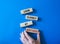 Look closely at mistakes symbol. Wooden blocks with words Look closely at mistakes. Businessman hand. Beautiful blue background.